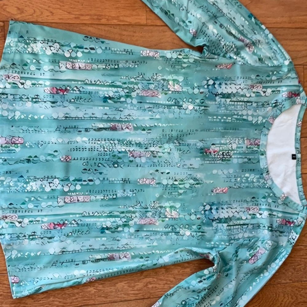 Greenish blue long sleeve top with multi color designs. Sz S New W/O tags